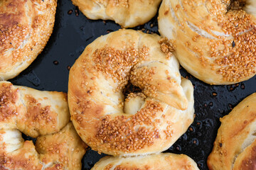 Close up homemade Turkish roll bagel with sesame it is called simit at native language.