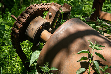 Rusty driving gears on a old mine train wagon for extracting charcoal from minefield, steam...