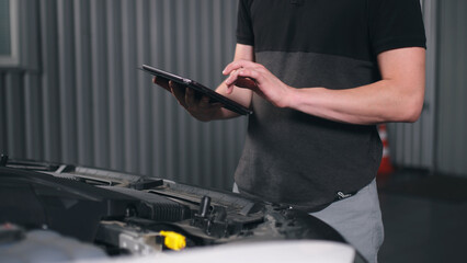 auto car service maintenance concept, talking to a customer and talking to a car manager to check and repair a car, meeting with a client in a garage. checking the results of diagnostics, maintenance 