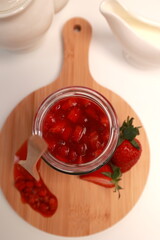Panna cotta Italian dessert with strawberries on a light background