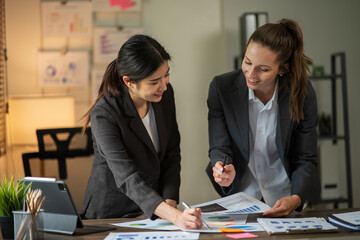 Asian businessmen, women and men Talk about new projects, presents at home office.