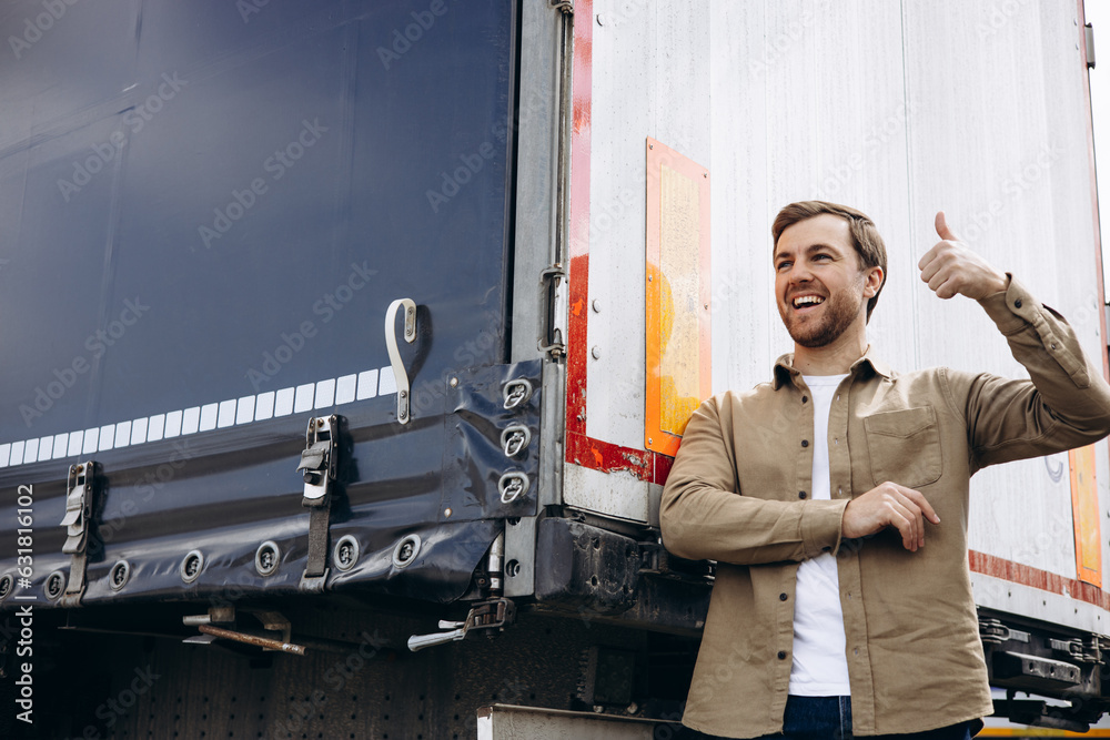 Wall mural truck driver standing by his lorry