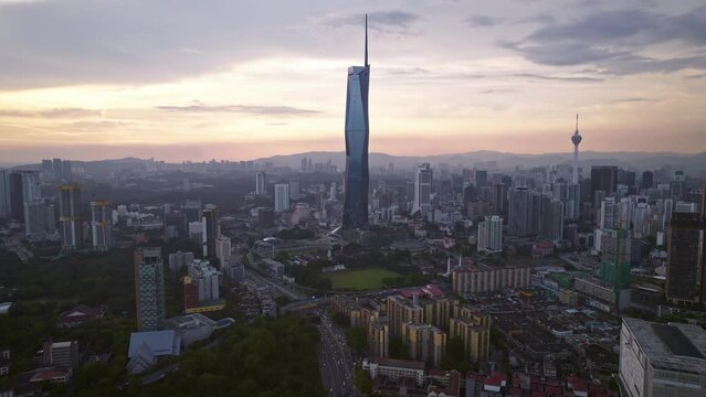 Kuala Lumpur city center with DJI Mavic Drone on beautiful Sunset: 
Petronas Twin Towers, Menara, Warisan, Merdeka skyline panorama, capital of Malaysia