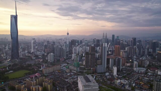 Kuala Lumpur city center with DJI Mavic Drone on beautiful Sunset: 
Petronas Twin Towers, Menara, Warisan, Merdeka skyline panorama, capital of Malaysia