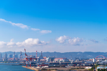 Wakayama cityscape with port and industry factory and  blue sky background, Wakayama city, Japan