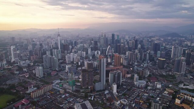 Kuala Lumpur city center with DJI Mavic Drone on beautiful Sunset: 
Petronas Twin Towers, Menara, Warisan, Merdeka skyline panorama, capital of Malaysia