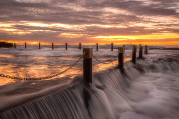 Over flowing tidal pool at dawn