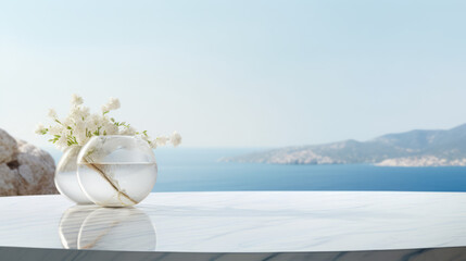 white flowers in two glasses with water on white marble surface with a view of the sea