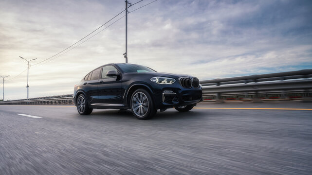 Seattle, Washington, USA, August 4, 2023 BMW x4 black. the car is driving on the highway. Performance M