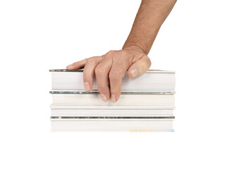 a male hand on top of a stack of books