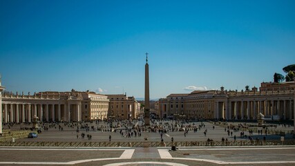 Saint Peter's Square in Rome, Italy with a lot of tourists on a sunny day