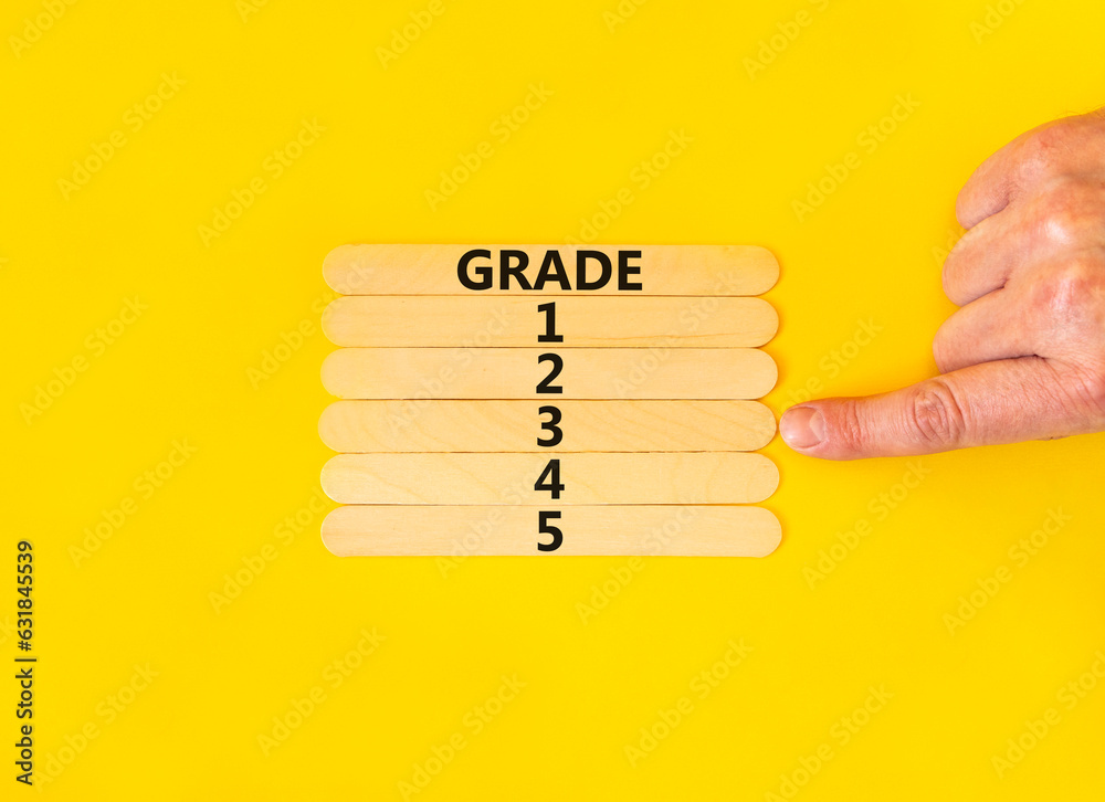 Wall mural time to grade 3 symbol. concept word grade 1 2 3 4 5 on wooden sticks. businessman hand. beautiful y