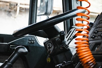 Closeup of the steering wheel with car keys.