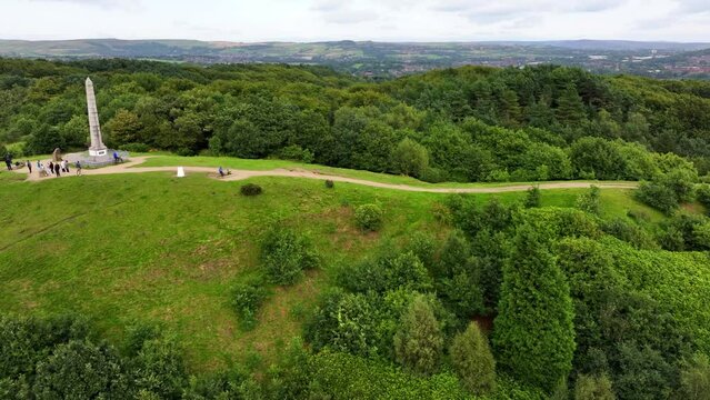 Tandle Hill and the green field with live stock grazing around. 