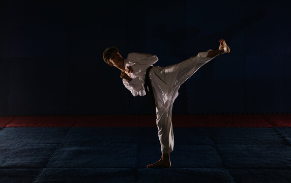 Karatist doing Yoko Geri