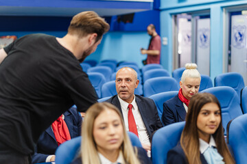 Obraz premium Male student discussing with his professor during break at university