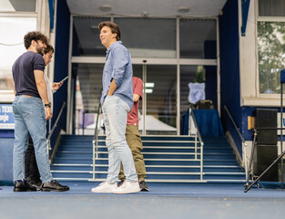 Fototapeta premium Four friends talking outside of the school