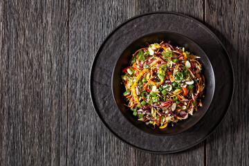 asian slaw, crunchy oriental cabbage salad in bowl - Powered by Adobe