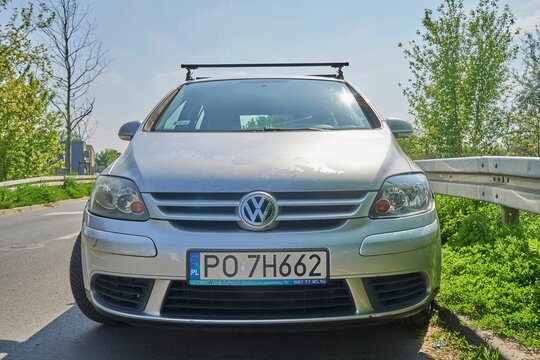 Poznan, Poland - April 2, 2023: A parked silver Volkswagen Golf Plus from 2006 on a road.