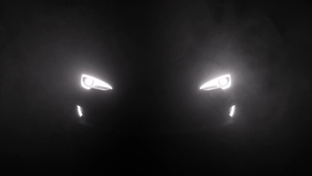 Close up of car led lights turn on revealing smoke moving through fog, sports car switches lights on and drives forward towards the camera.