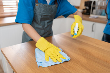 Close up hand cleaning home and wiping with microfiber cloth in kitchen room at home	