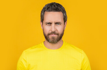 bearded man wear yellow tshirt on background. man wear yellow tshirt in studio.