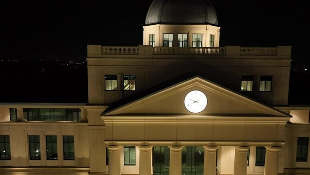 Aerial view of Denton Texas courthouse illuminated by lights at night