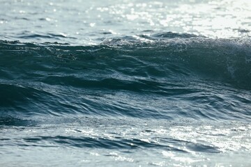 Blue ocean wave creating a soothing atmosphere.