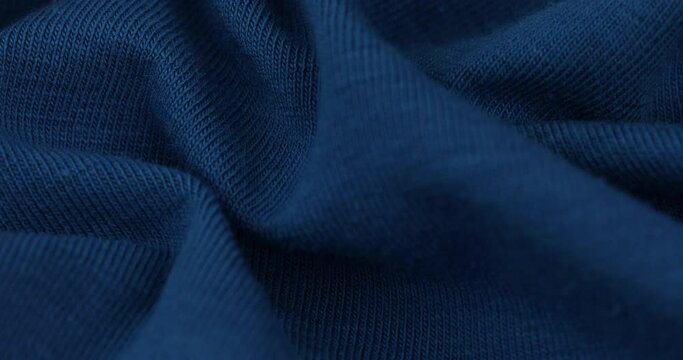 Closeup video of blue knitted fabric