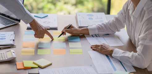 Business People brainstorming Meeting Design Ideas use post it notes to share idea professional...