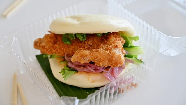 bao bun in plastic box . Traditional asian street food concept 