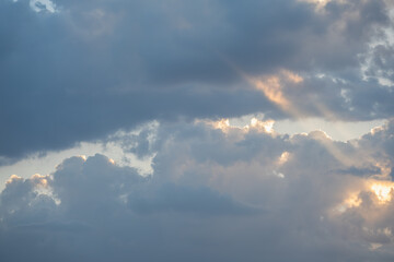 Naklejka na ściany i meble Cloudy Sky with Light Glimmers and Blue Background