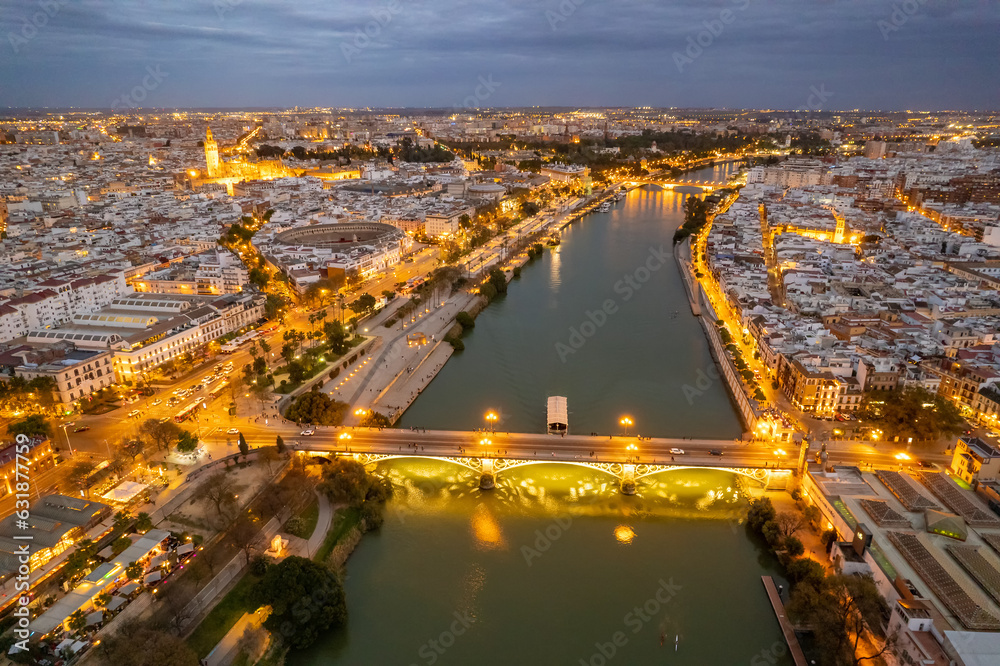 Wall mural aerial view of the seville cityscape at night, andalusia region, spain.