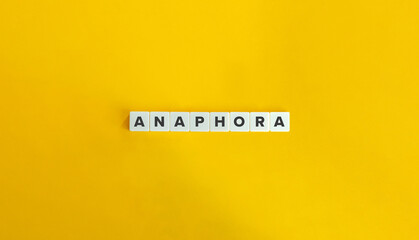 Anaphora Word on Letter Tiles on Yellow Background. Minimal Aesthetic.