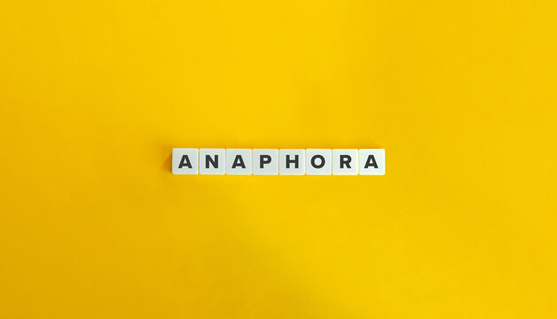 Anaphora Word on Letter Tiles on Yellow Background. Minimal Aesthetic.