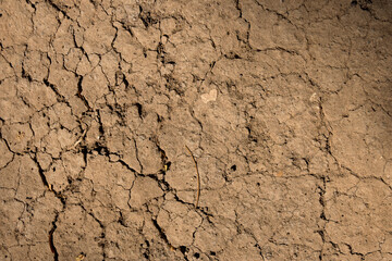 Wall texture soil dry crack pattern of drought lack of water of nature brown old broken background.