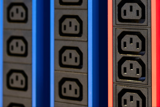 Electricity sockets IEC 60320 C13 in the server rack. Electicity sockets (Iin the server rack as technology style concept background as template, page or web banner