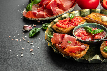 toasted bread with jamon cured ham and tomatoes for breakfast. Restaurant menu, dieting, cookbook recipe top view