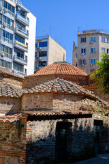 An ottaman hamam with modern buildings in the back. This is the womens hamam in thessaloniki greece.