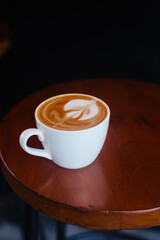 Delicious cappuccino on a wooden coffee table Double coffee for breakfast
