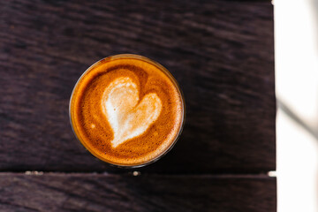 Delicious beautiful cappuccino in a flat lay glass glass. Stylish concept of advertising coffee and fresh beans