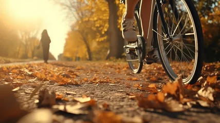 Papier Peint photo Vélo bicycle in motion autumn background wheels leaves flying in autumn park fall sunny day