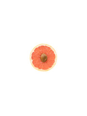 Grapefruit with apricot pit. Minimal  abstract summer food concept.