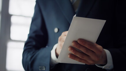 Man receiving bribe envelope close up. Male hands taking money hundreds euro.