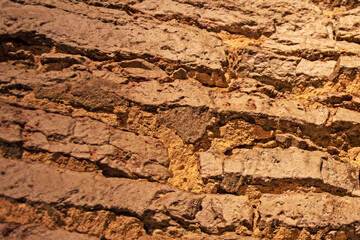 brown natural background of old brickwork walls of the middle ages. Finishing modern materials
