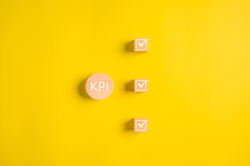 KPI, Key performance indicator, Businessman holding wooden cube with KPI icon, Business analysis...