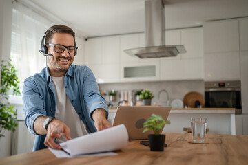 One man caucasian male freelancer work from home on laptop computer