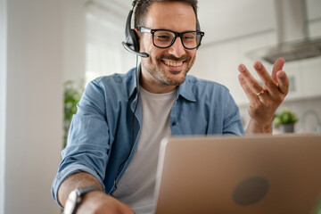 One man caucasian male freelancer work from home on laptop computer