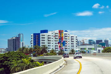 Miami, Florida, USA - Turning left to I-195. A colorful apartment building.