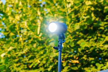 Outdoor flash on a tripod for professional outdoor photography. 